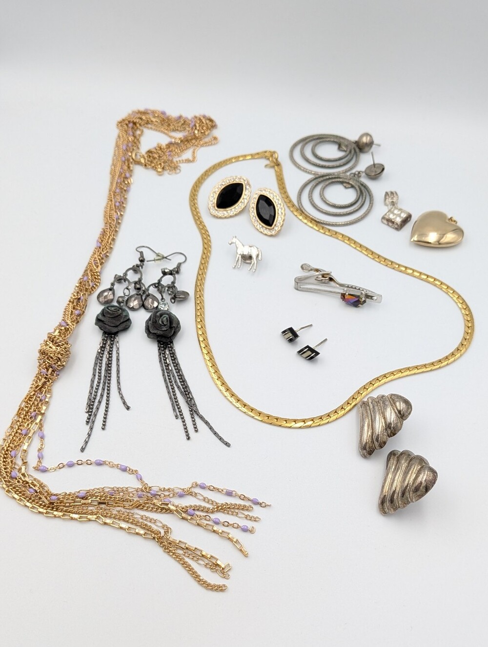 Vintage to modern mixed jewelry lot with earrings, necklaces, and more